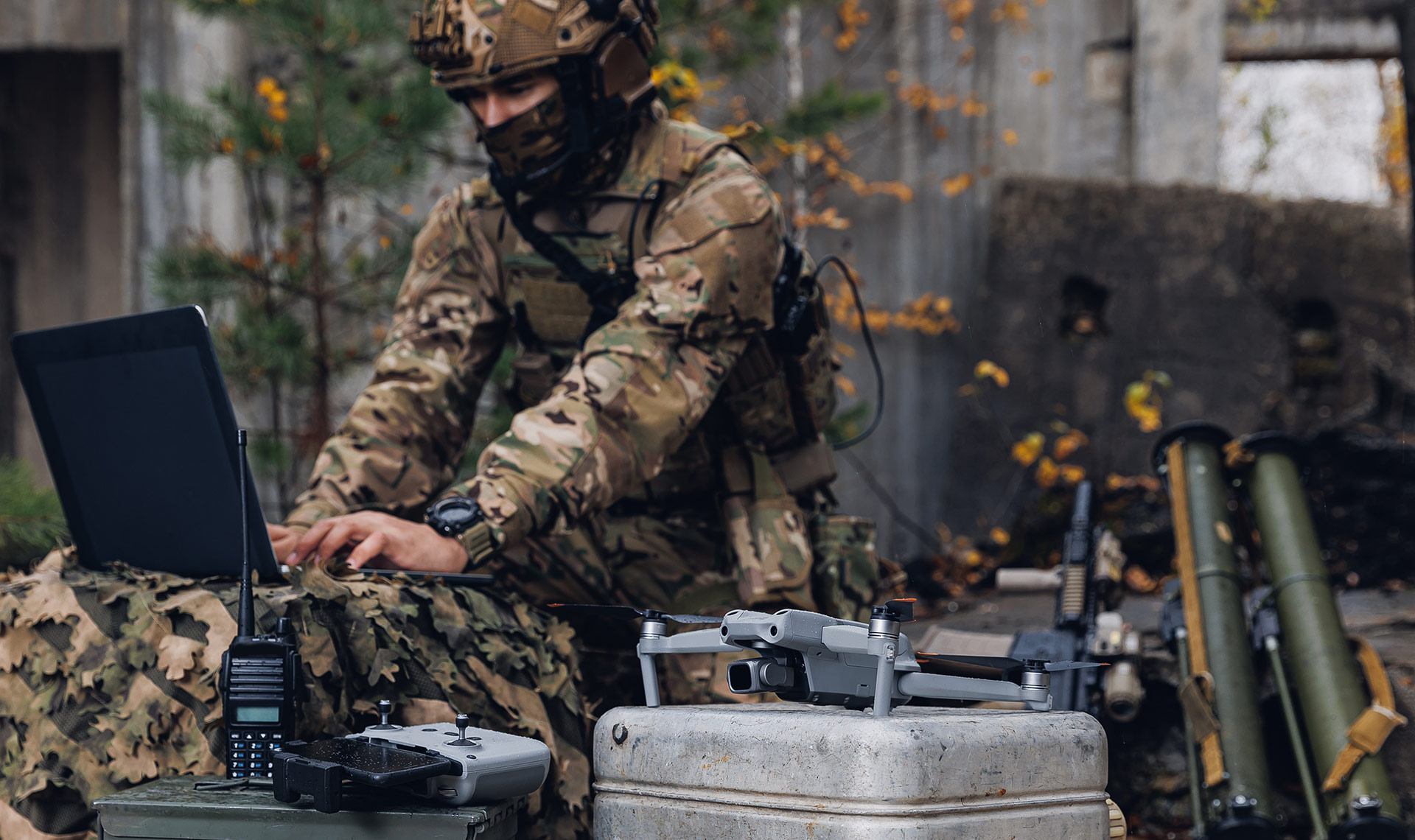 Mobile military base - A soldier transmitting intelligence surveillance and reconnaissance data from a drone to artillery.